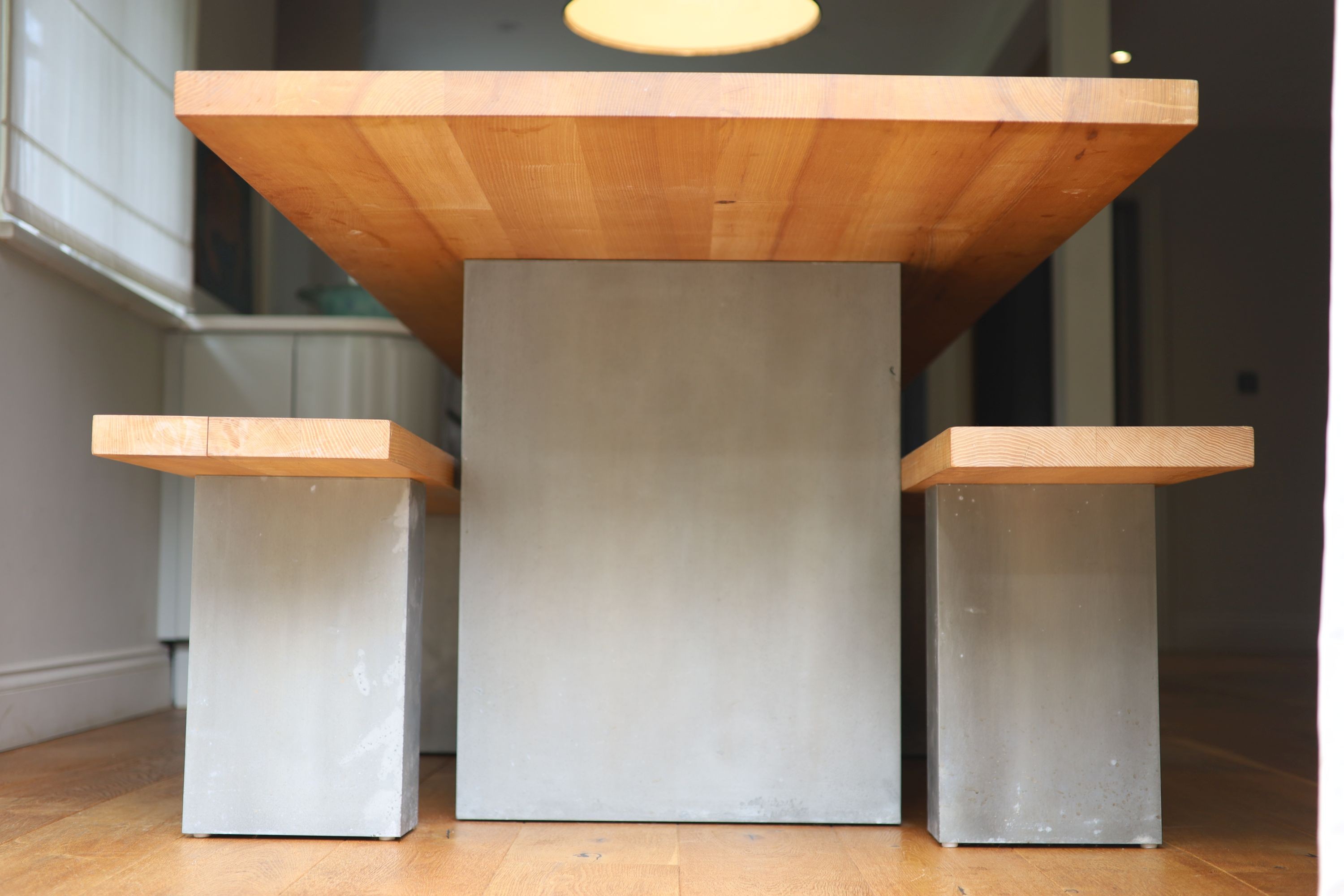 A contemporary oak kitchen table with pair of matching benches and oxidised metal supports, table width 230cm depth 90cm height 74cm, benches width 180cm